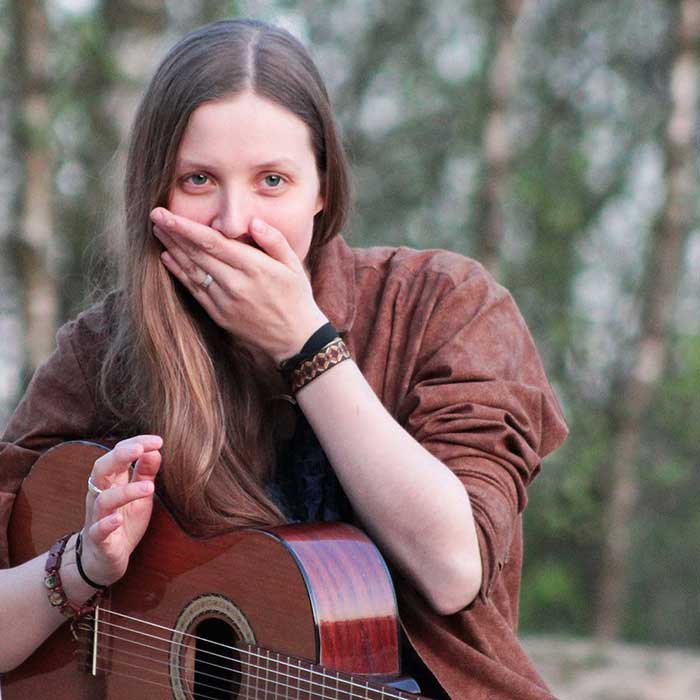 Beautiful girl playing guitar