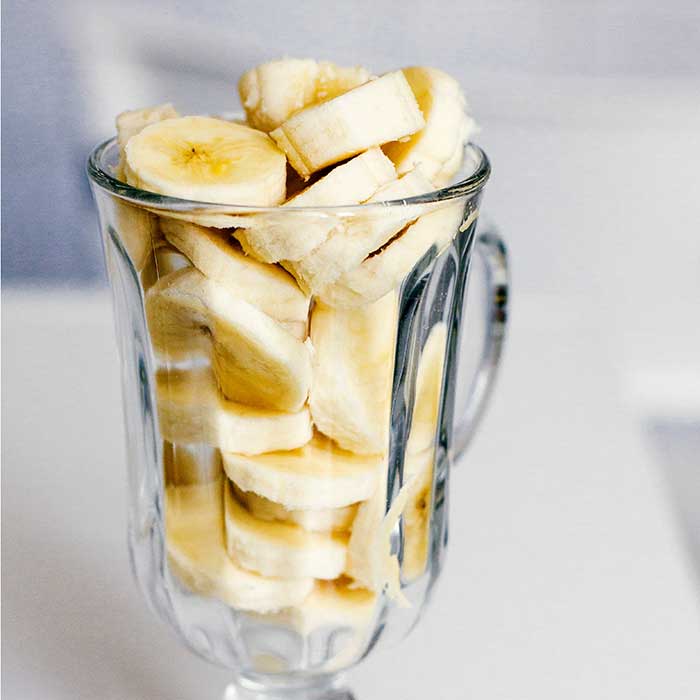 Glass of sliced banana