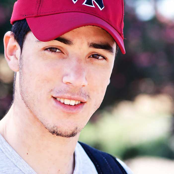 Handsome smiling boy with red cap