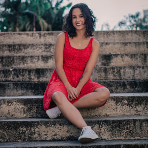 woman smiling in red dress